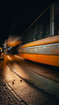 Stunning long exposure capture of a tram moving in Berlin at night.