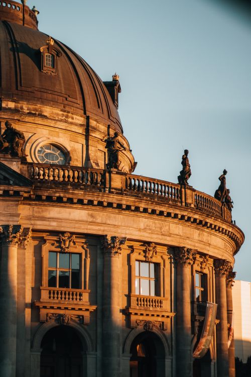 Free Dome and statues of Bode Museum in warm sunset light, Berlin. Stock Photo