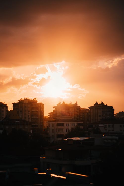 Free A stunning orange sunset casting a warm glow over the Berlin cityscape. Stock Photo