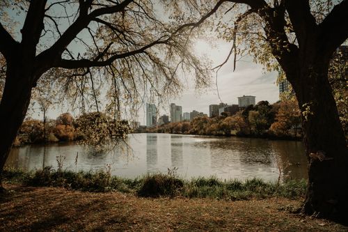 Free Serene autumn scene by the water with Milwaukee skyline and fall foliage. Stock Photo