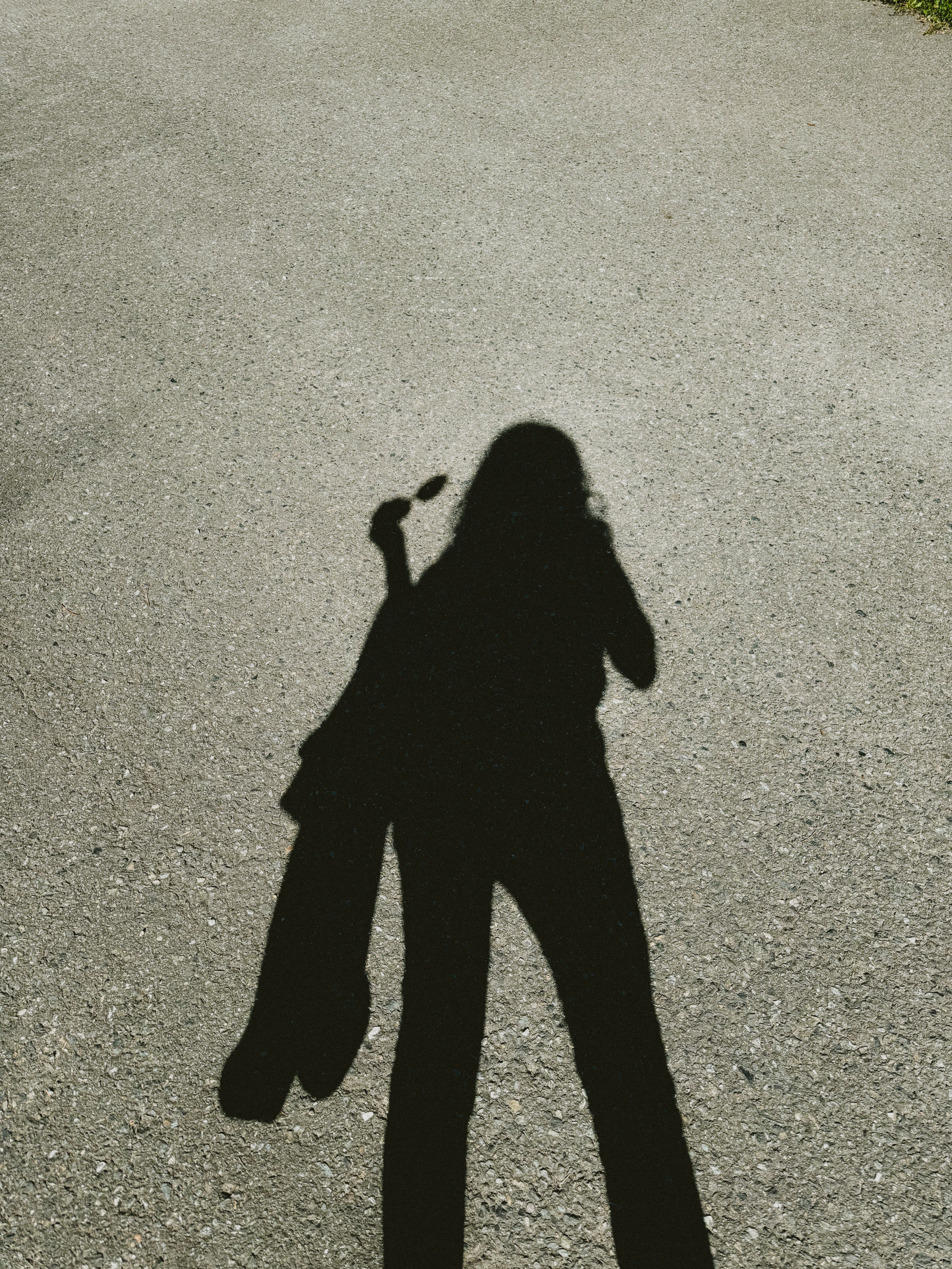 Shadow of Person Holding Object on Ground · Free Stock Photo