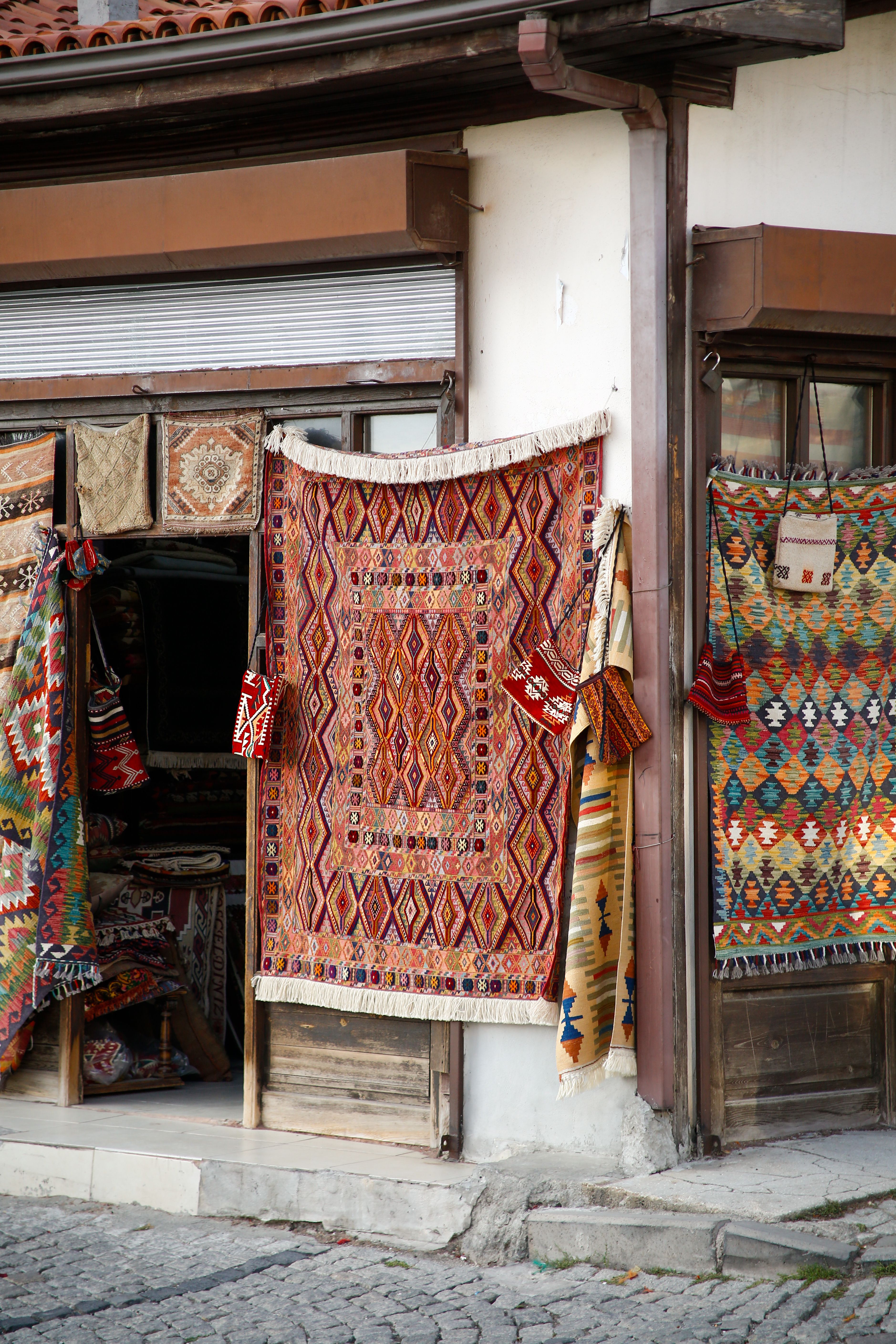 Colorful Traditional Rugs Displayed in Market · Free Stock Photo
