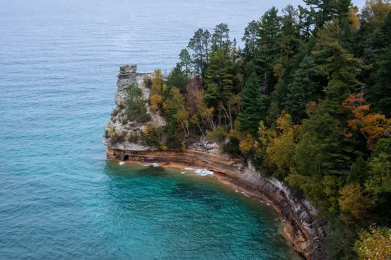 Chapel Rock and the lone pine on its sandstone arch, Pictured Rocks
