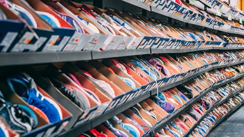 Shoes in Boxes on Shelf