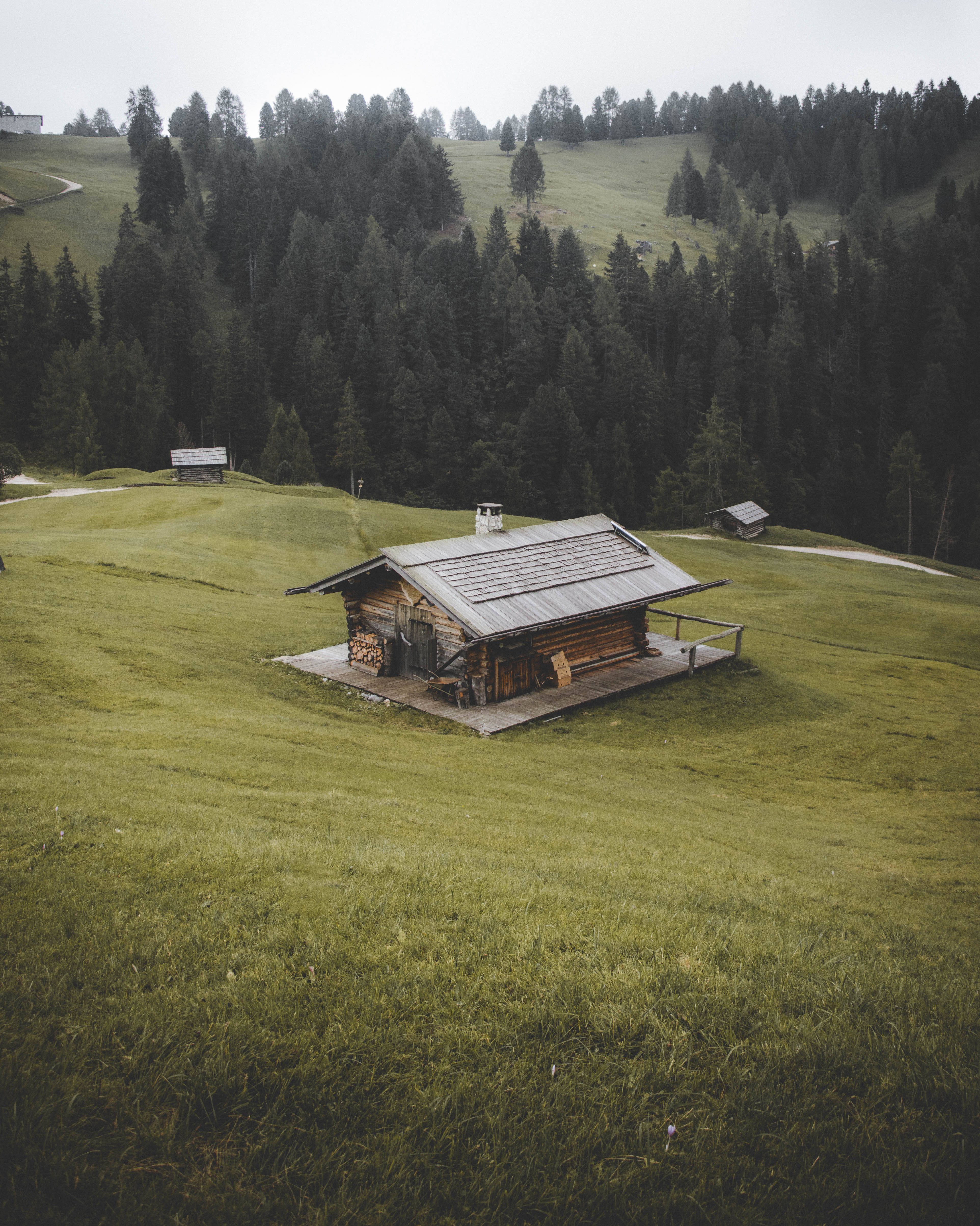 Wooden Cabins on Hill in Mountain Landscape · Free Stock Photo