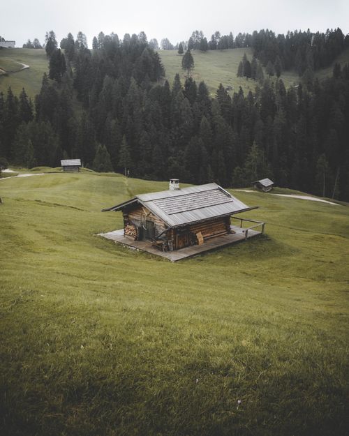 Free A serene rustic cabin nestled in the lush hills of Trentino-Alto Adige, Italy. Stock Photo