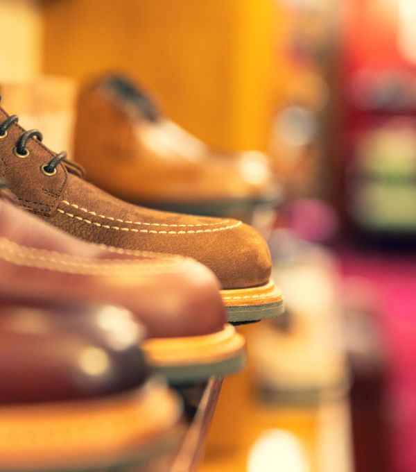 Leather boots displayed on a shelf in a footwear store