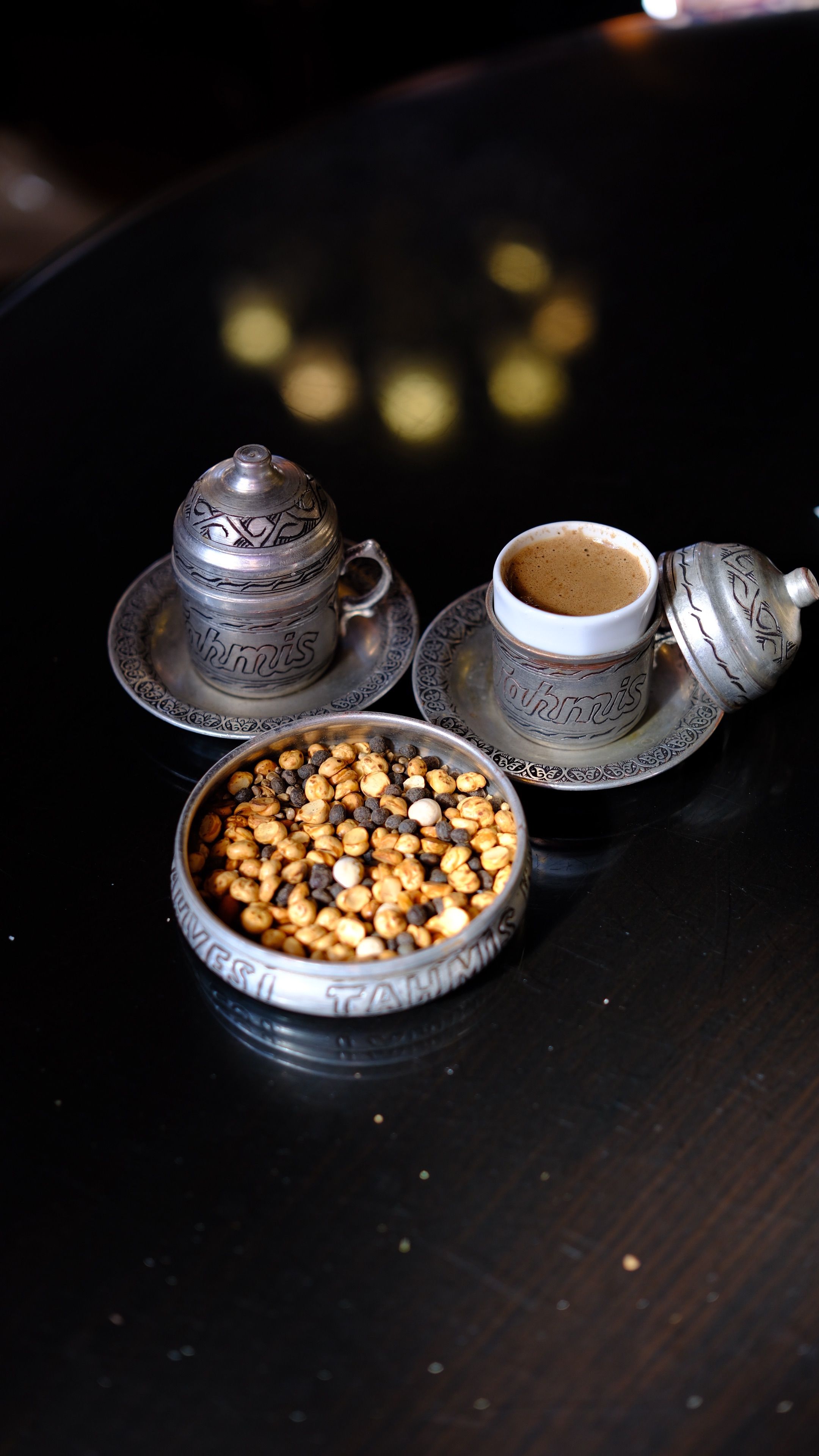 Traditional Turkish coffee and snacks in elegant silverware, embodying Gaziantep's rich culture.