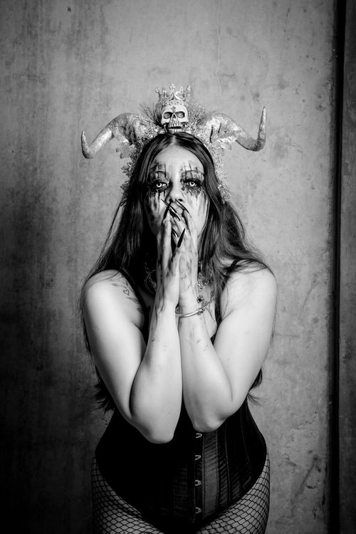 Free Black and white portrait of woman with Gothic makeup and Halloween costume, creates a haunting mood. Stock Photo