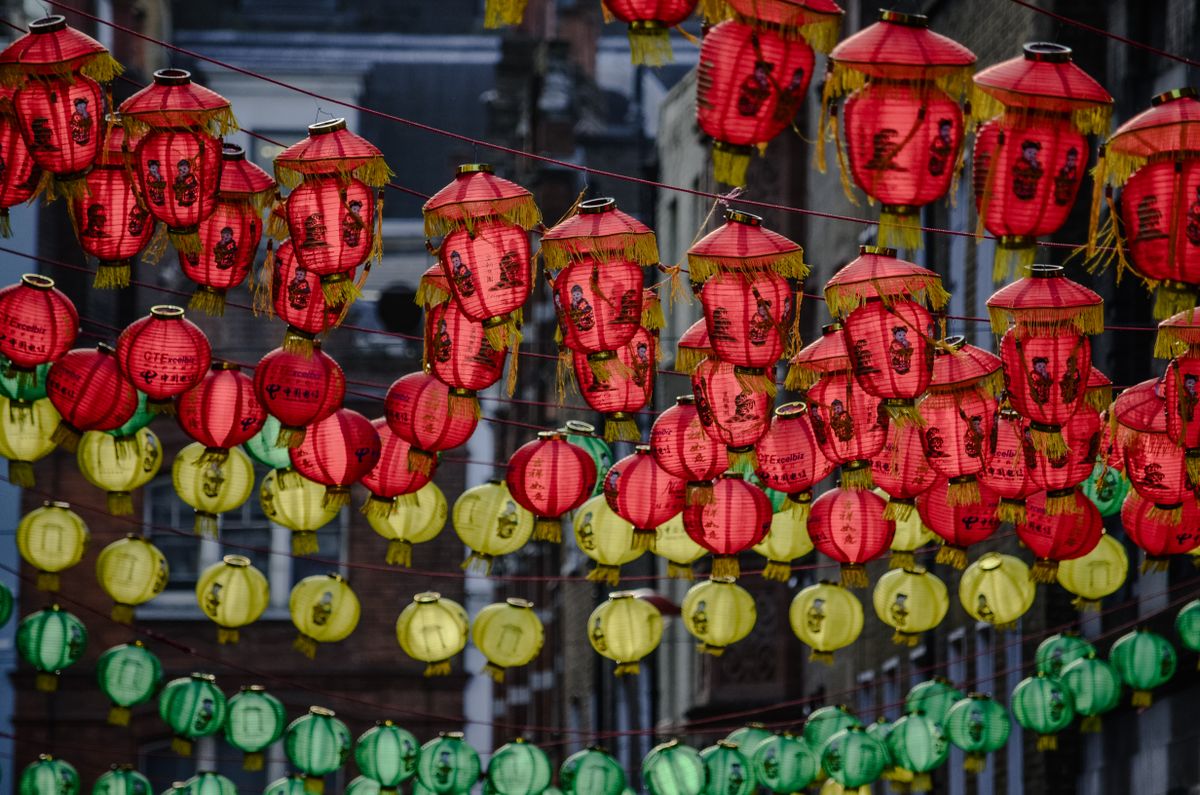 Vibrant Chinese red lanterns hanging across a street in London's Chinatown