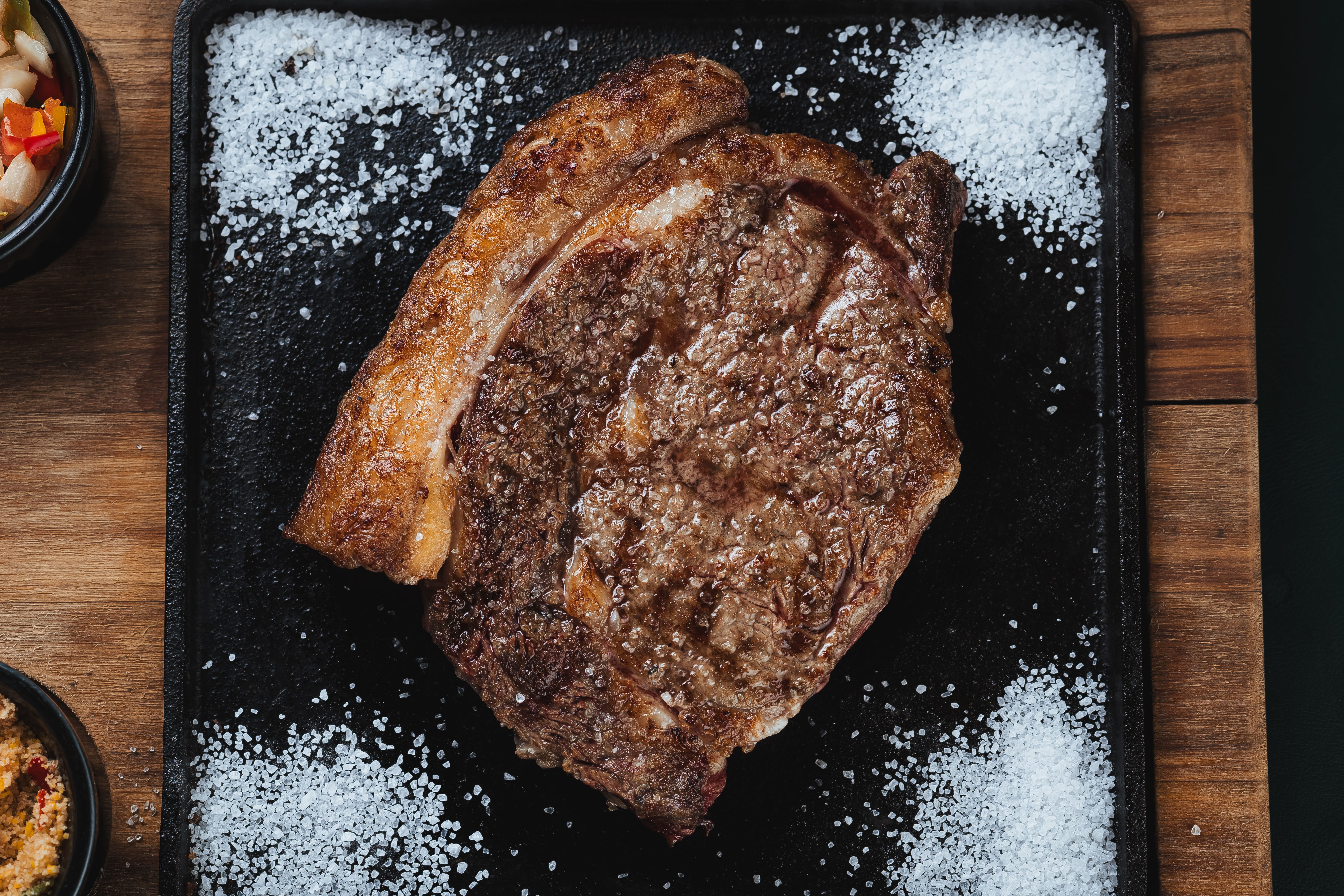 Seared ribeye under warm spotlight