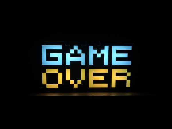 Pixel-art neon sign glowing in the dark — photo by Forse Jorre on Pexels
