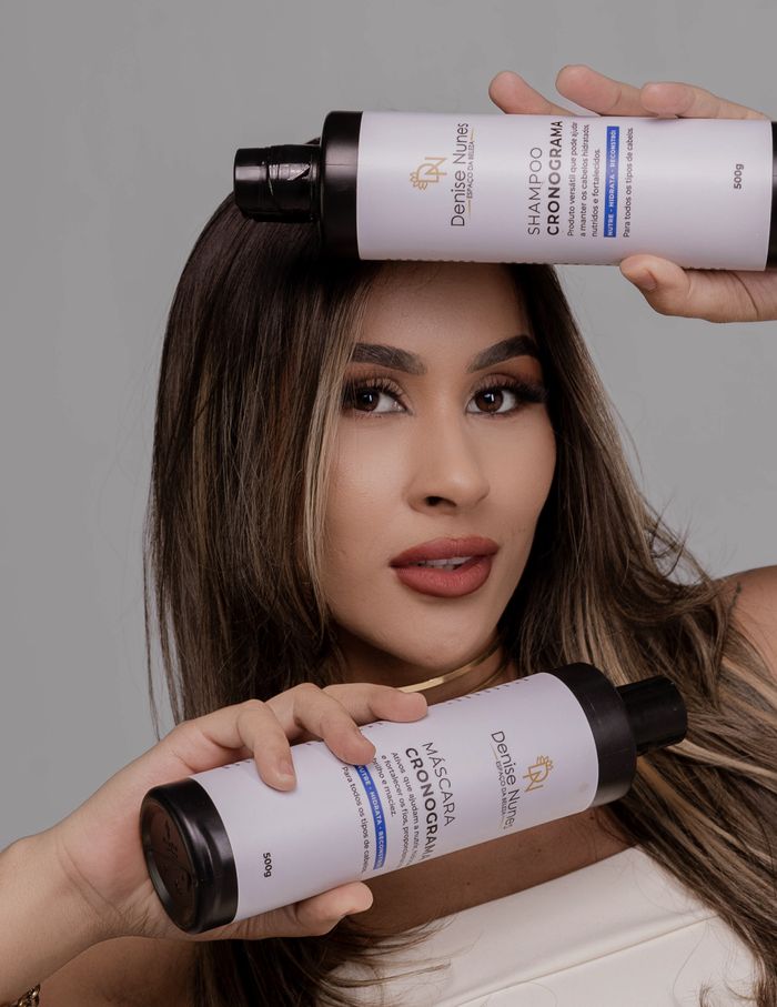 Woman with hair care shampoo products