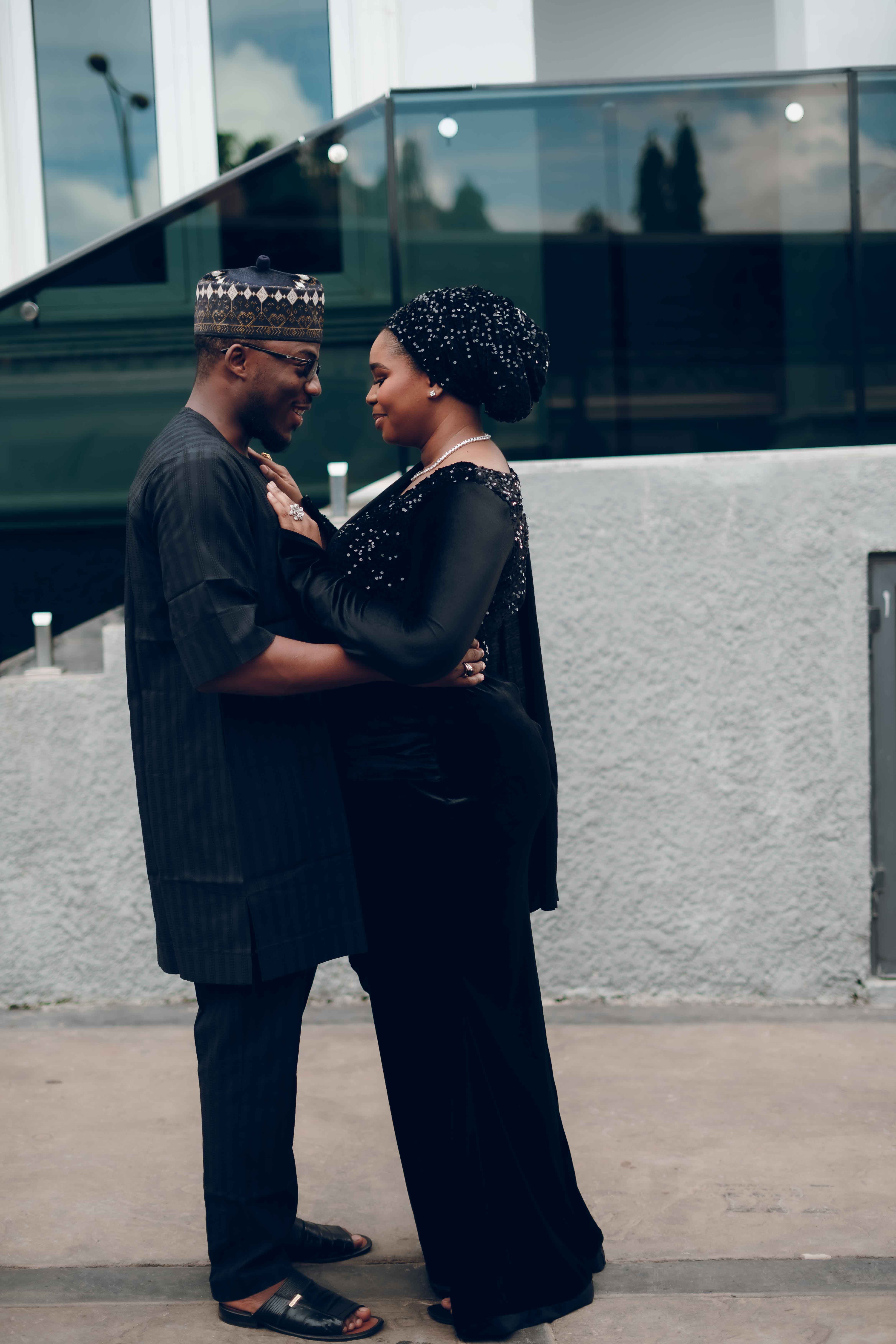 Elegant Couple Embracing in Traditional Attire · Free Stock Photo