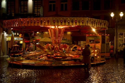 Spinning Carousel in Amusements Park at Night