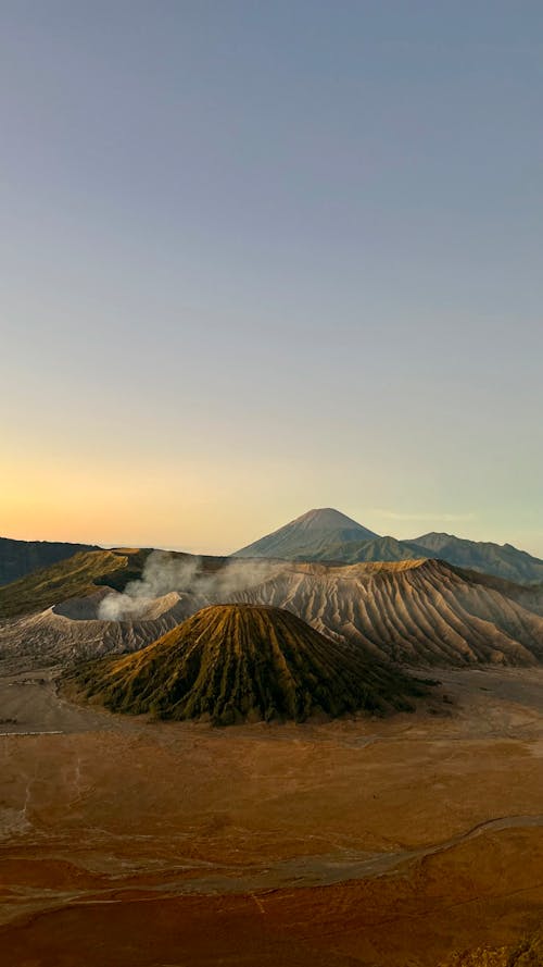 Free A breathtaking sunrise view of Mount Bromo, a prominent volcano in East Java, Indonesia. Stock Photo