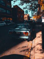 Street View of Urban Downtown with Parked Cars · Free Stock Photo