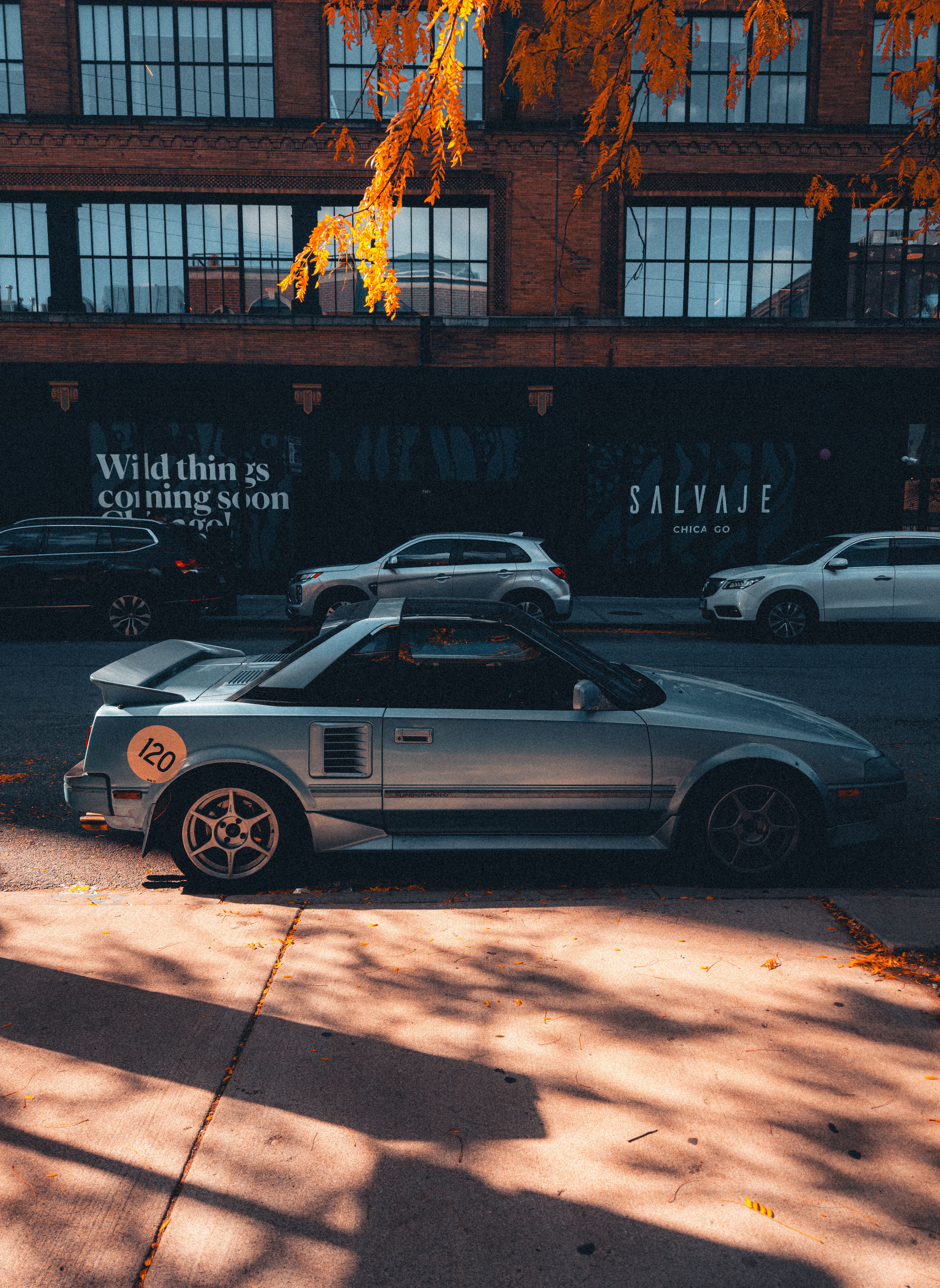 Street View of Urban Downtown with Parked Cars · Free Stock Photo