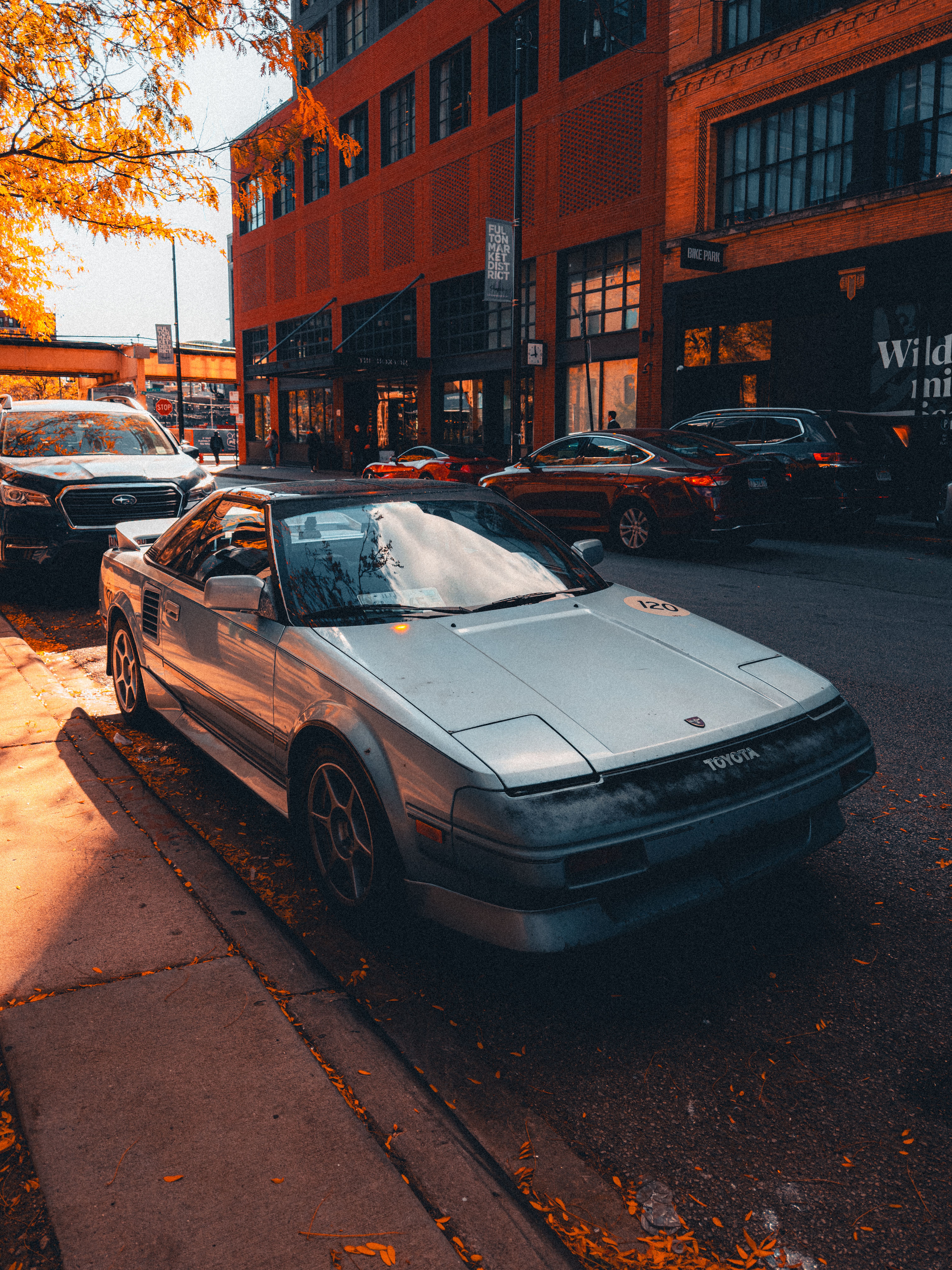 Street View of Urban Downtown with Parked Cars · Free Stock Photo
