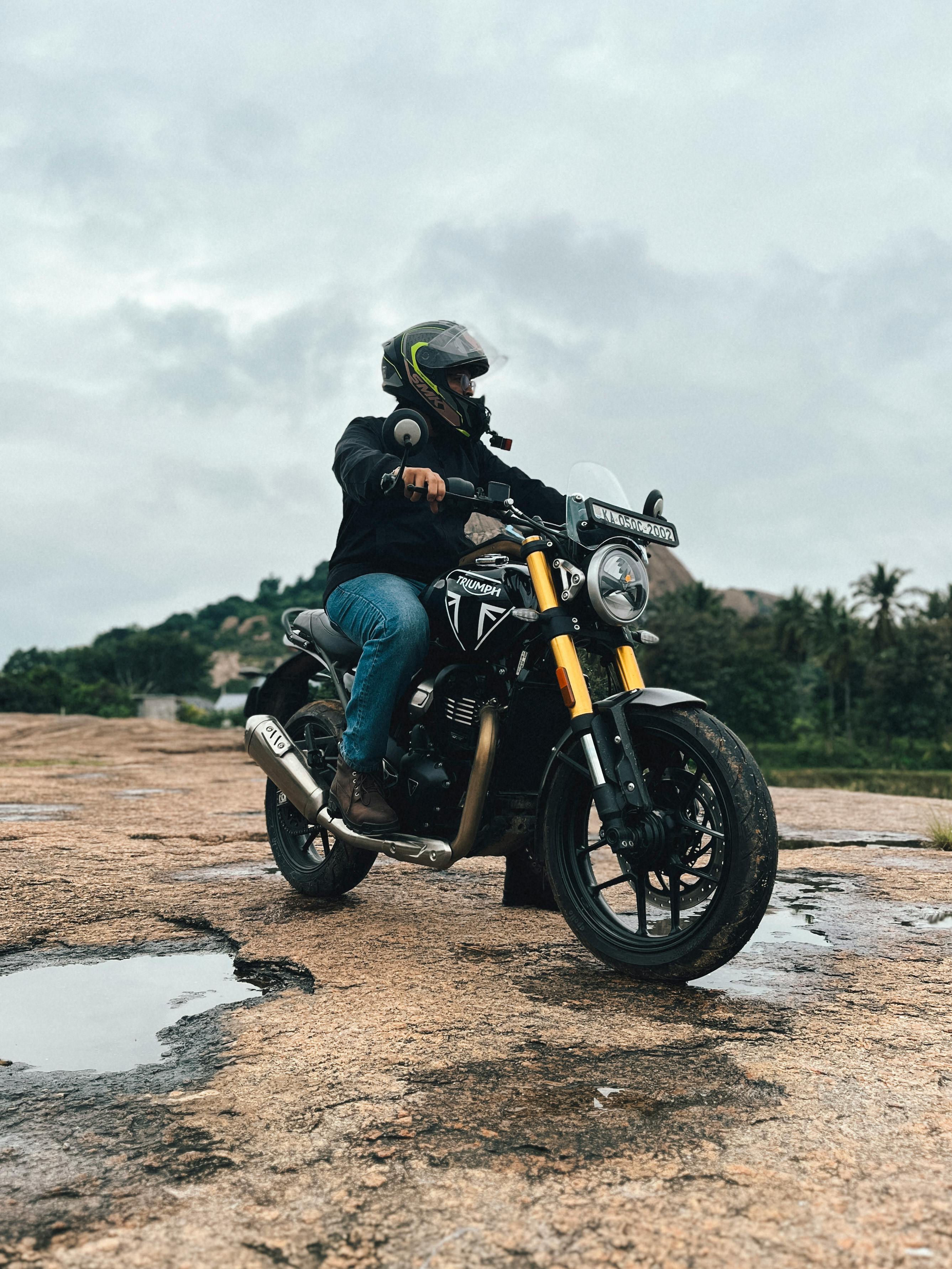 A rider on a motorcycle explores the scenic landscapes of Bengaluru, India.