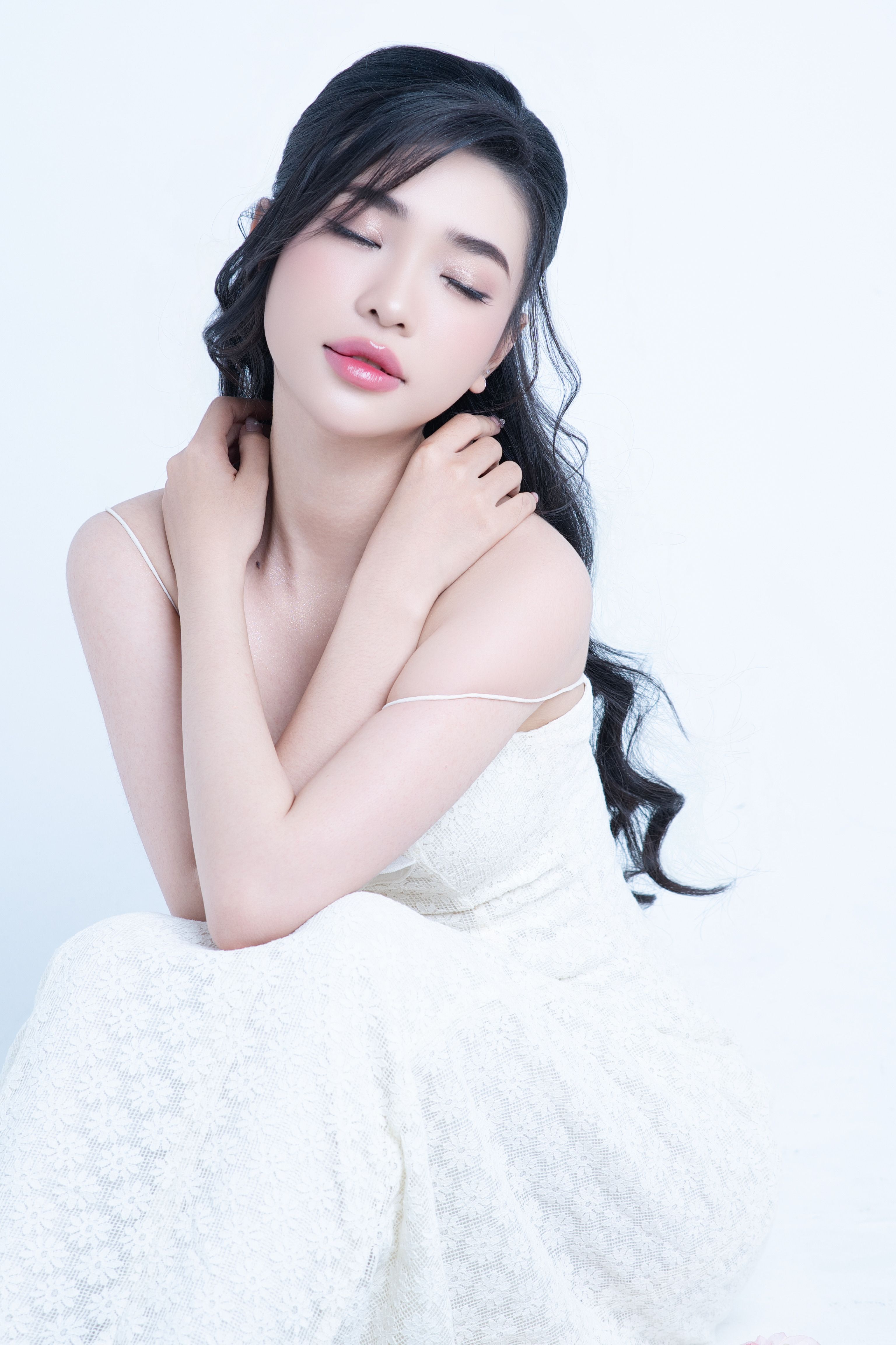 Elegant Portrait of a Woman in White Dress · Free Stock Photo