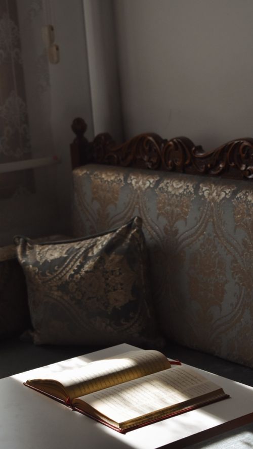 Free A vintage home interior with an open book radiating in sunlight, adding a cozy feel. Stock Photo