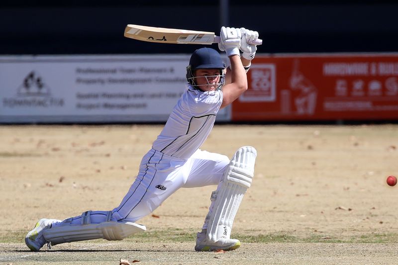 Cricket player performing a forward stroke