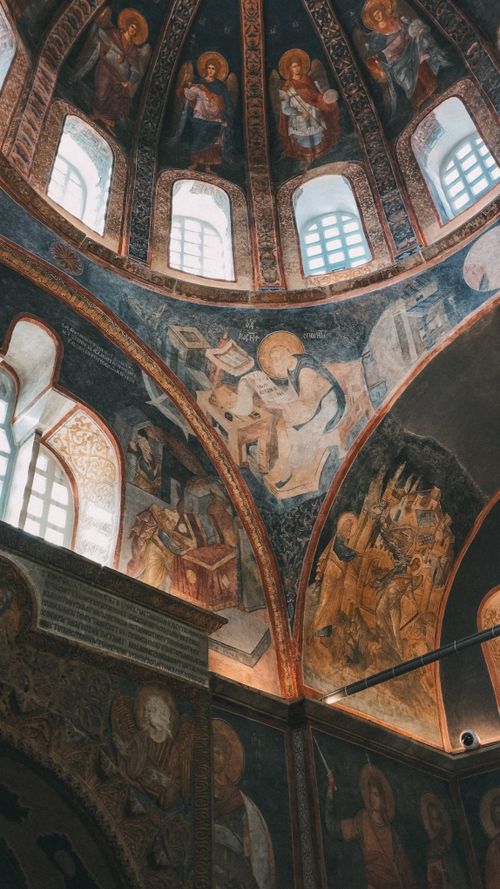 Free Explore the stunning Byzantine frescoes adorning an ancient church's dome, capturing timeless artistry. Stock Photo
