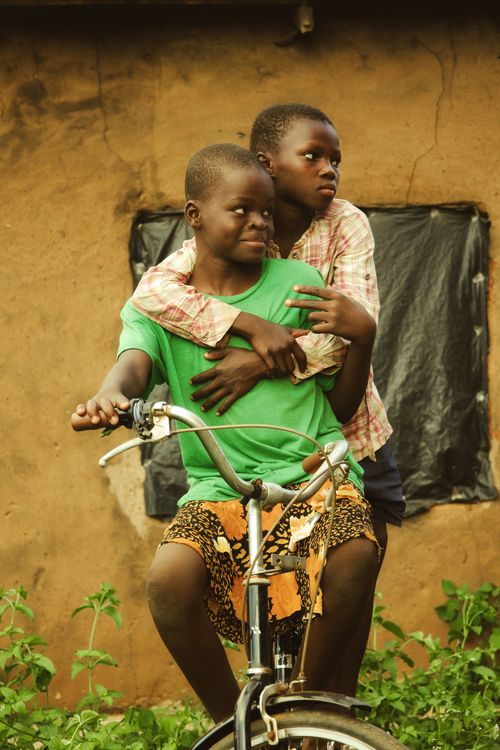 Joyous African Children Riding A Bicycle Outdoors Free Stock Photo Joyous African Children Riding A Bicycle Outdoors Free Stock Photo