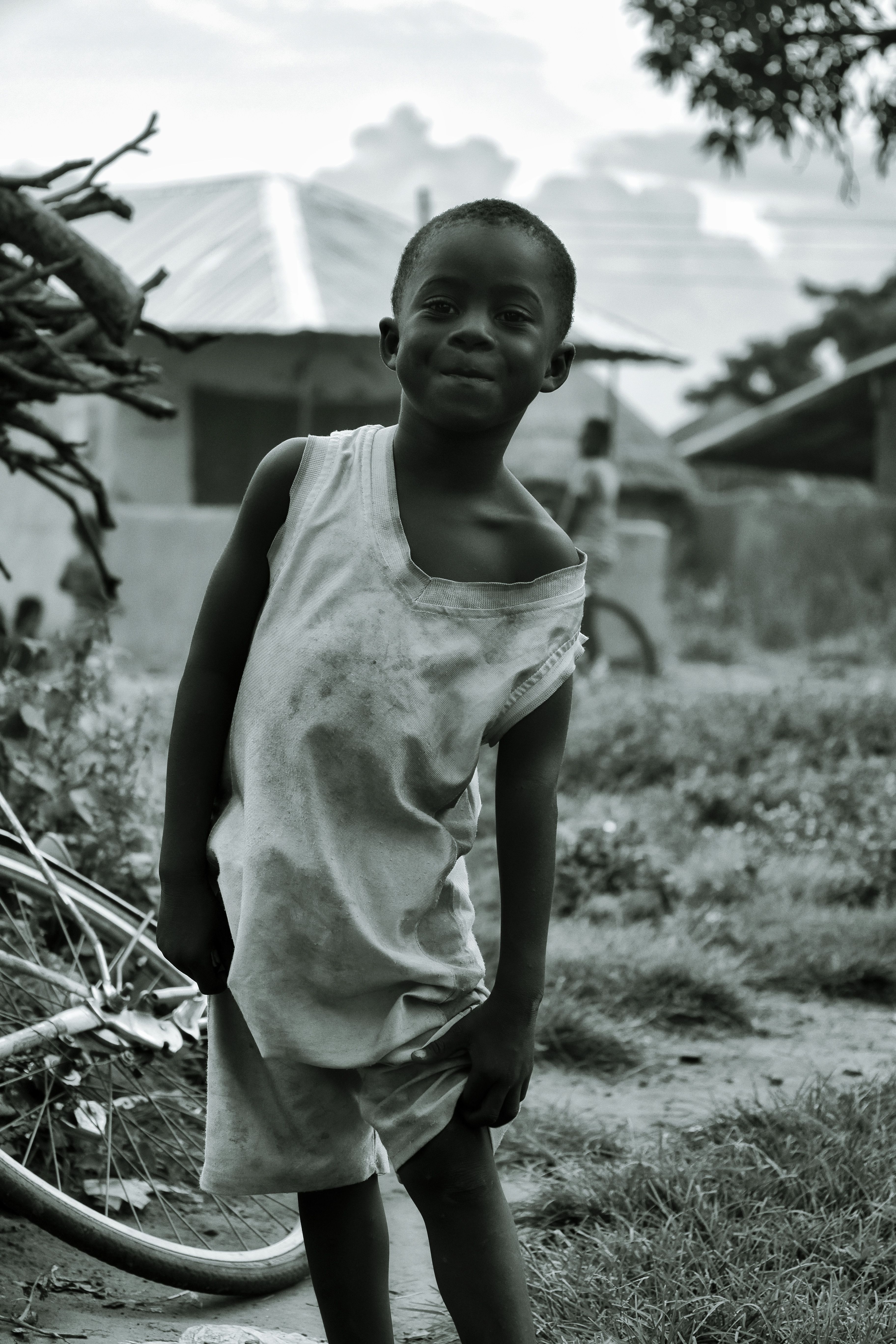Smiling African Child in Rural Village Setting · Free Stock Photo