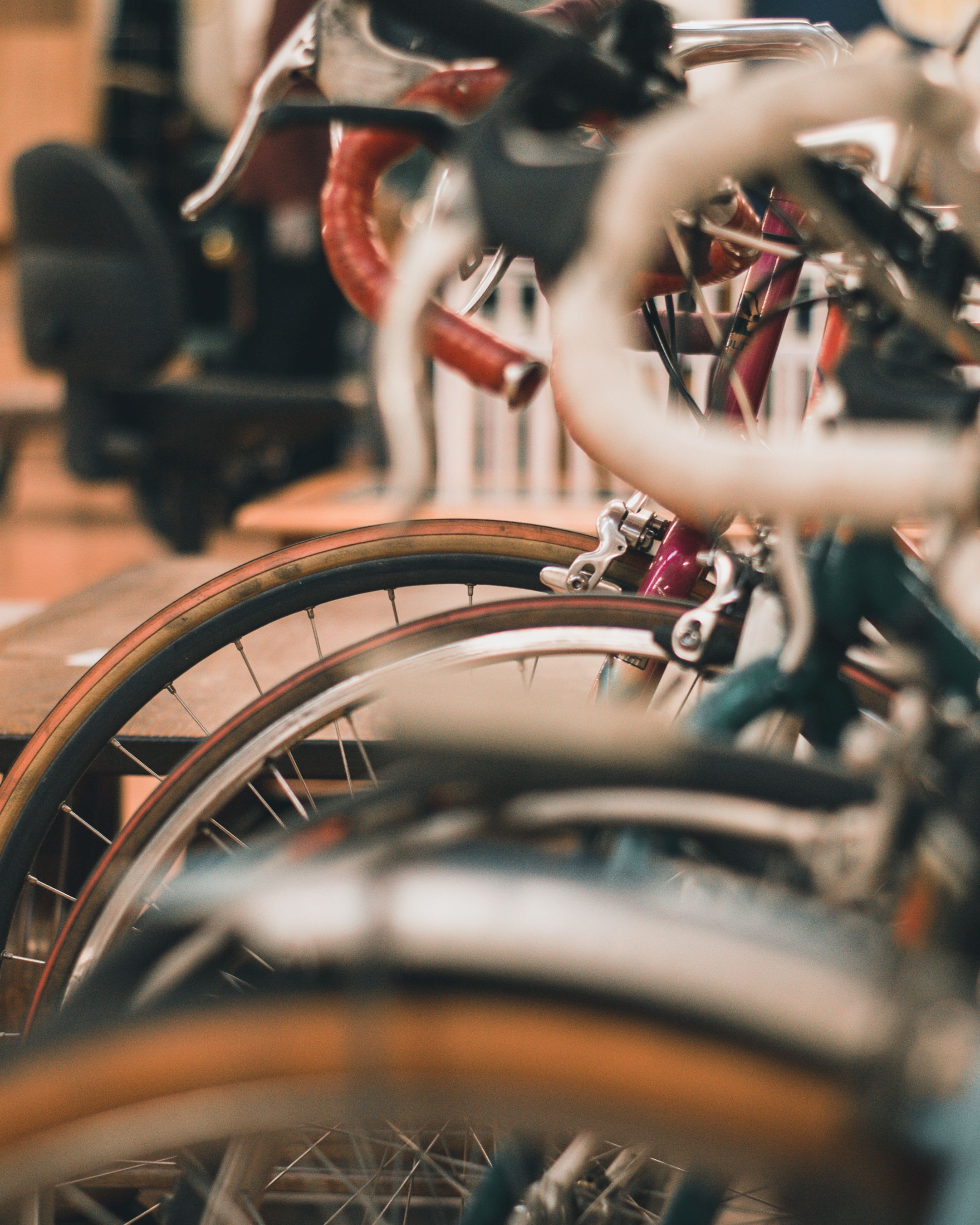 Artistic close-up shot of colorful bicycles in a row, showcasing their structure and design.