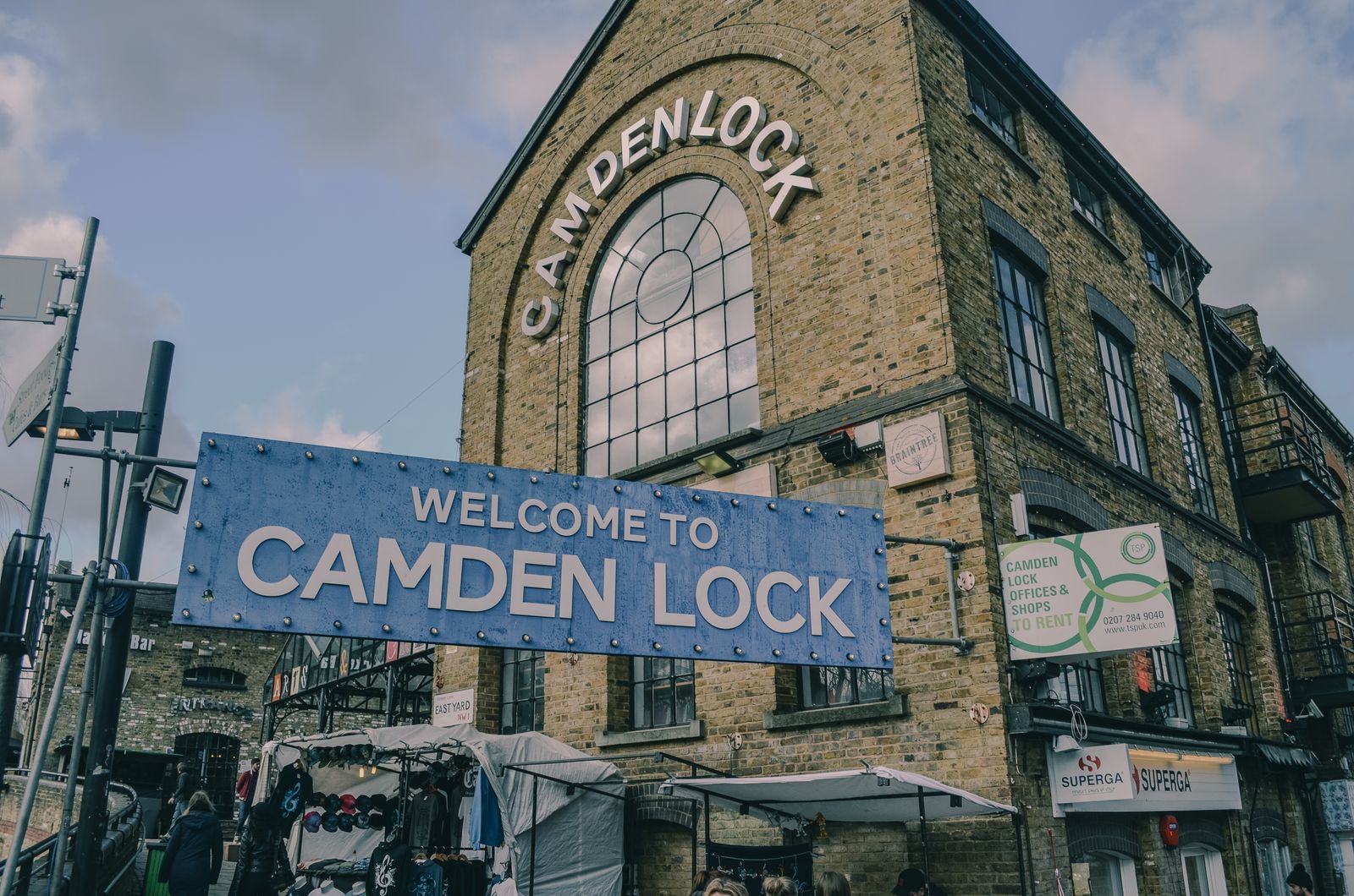 The colourful painted facade of Camden Lock Market beside the canal