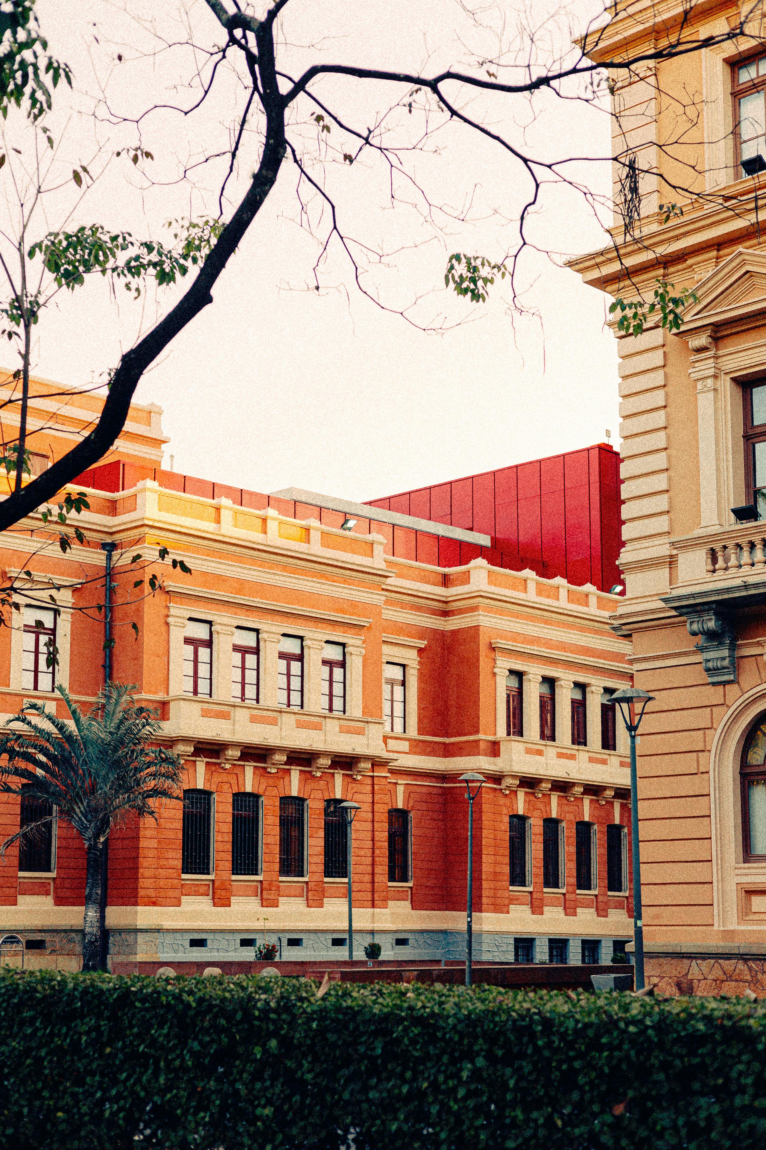 Elegant historical building with vibrant colors and soft sunset ambiance.