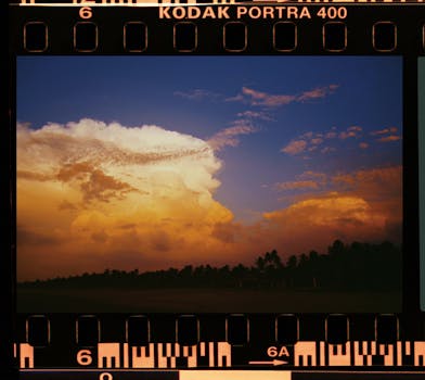 Capture of a vibrant sunset with dramatic clouds on Kodak Portra 400 film.