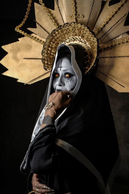 Free Intriguing portrait of a person in stylized costume and halo headpiece. Stock Photo