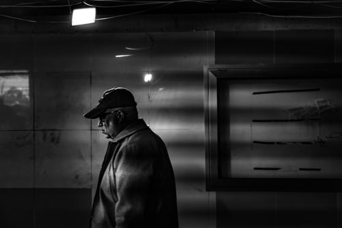 Free Black and white photo of a solitary man walking in an İstanbul subway. Stock Photo
