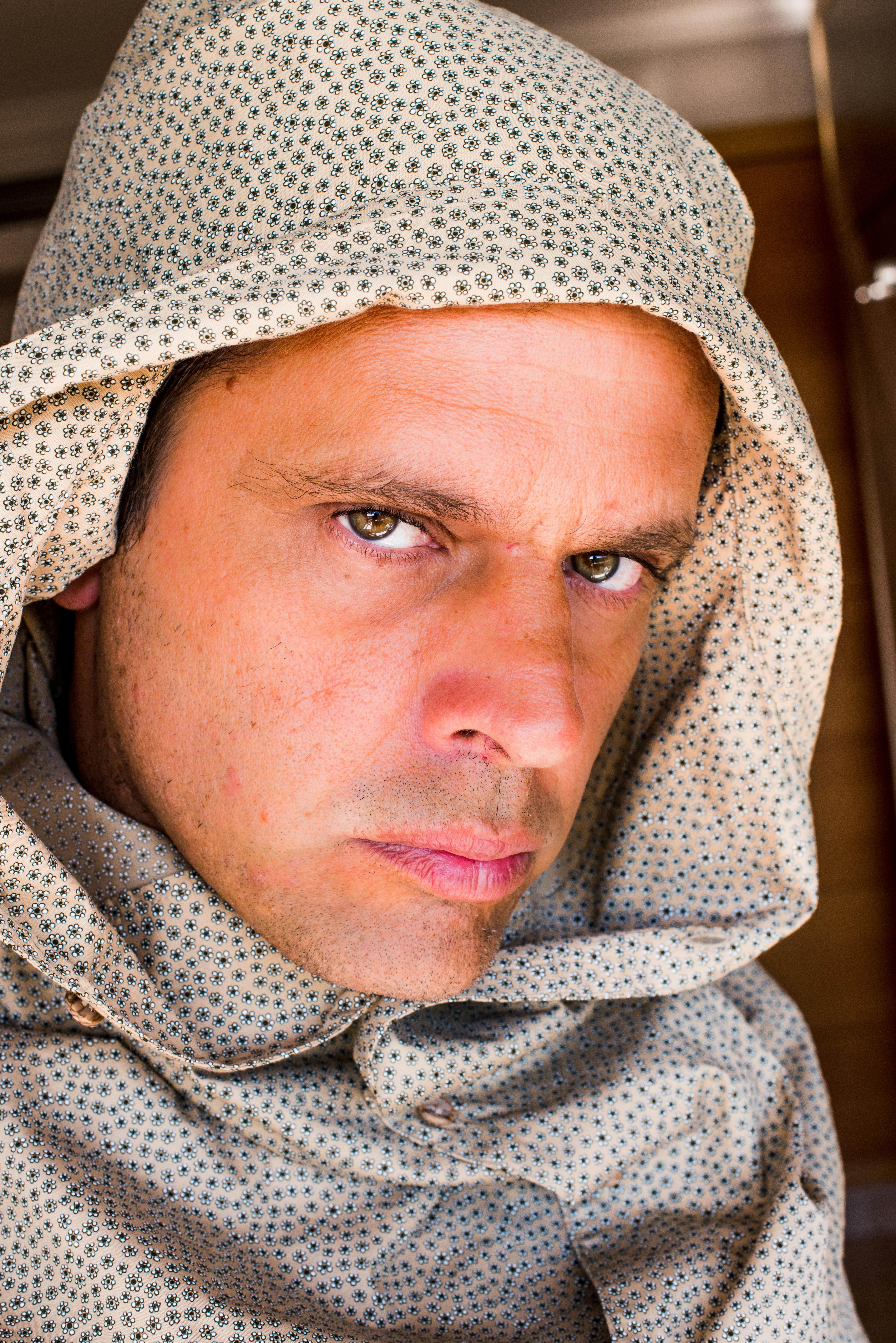Close up Portrait of Man in Patterned Hoodie · Free Stock Photo