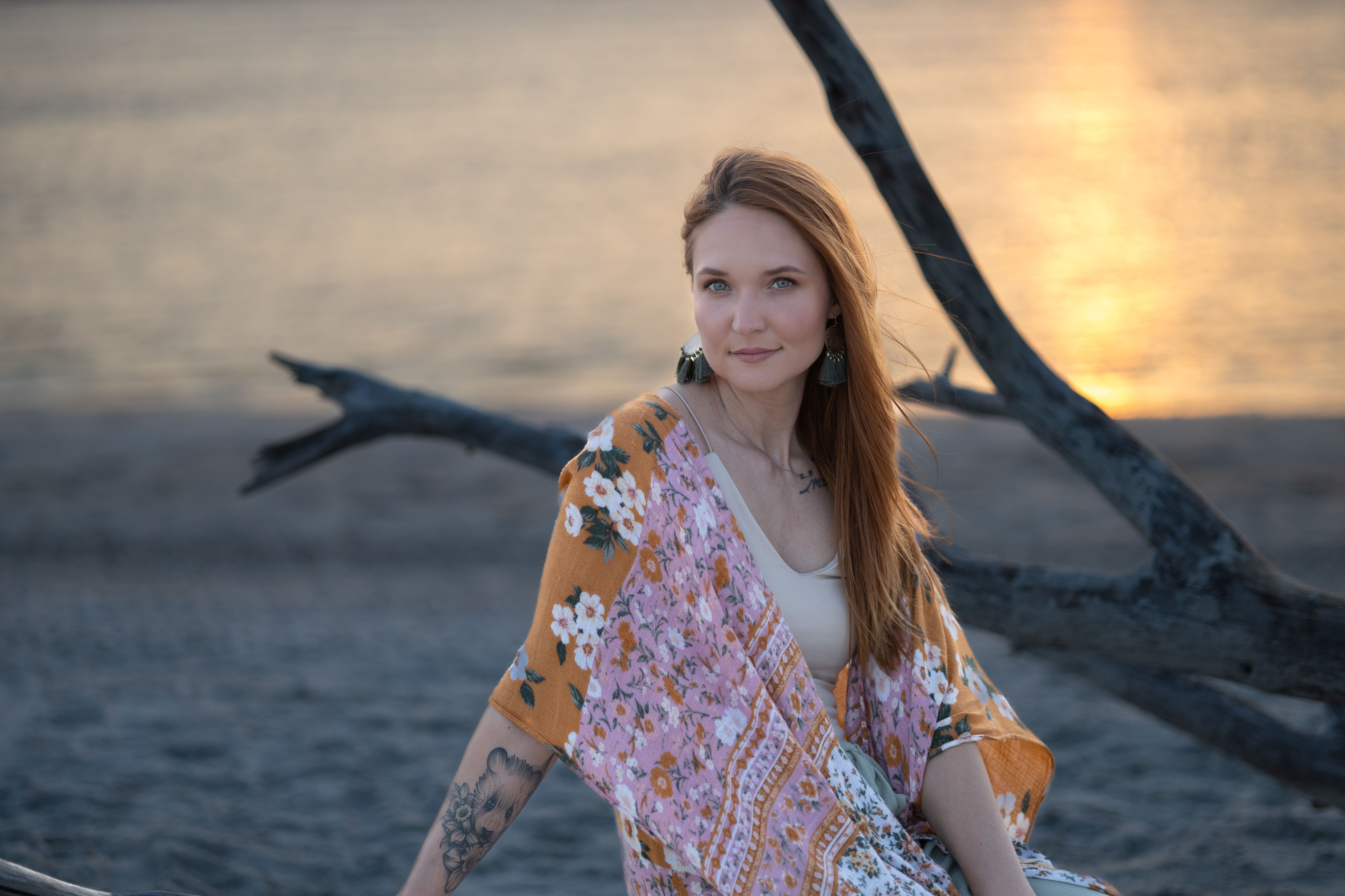 Young Woman Posing by Beach at Sunset · Free Stock Photo