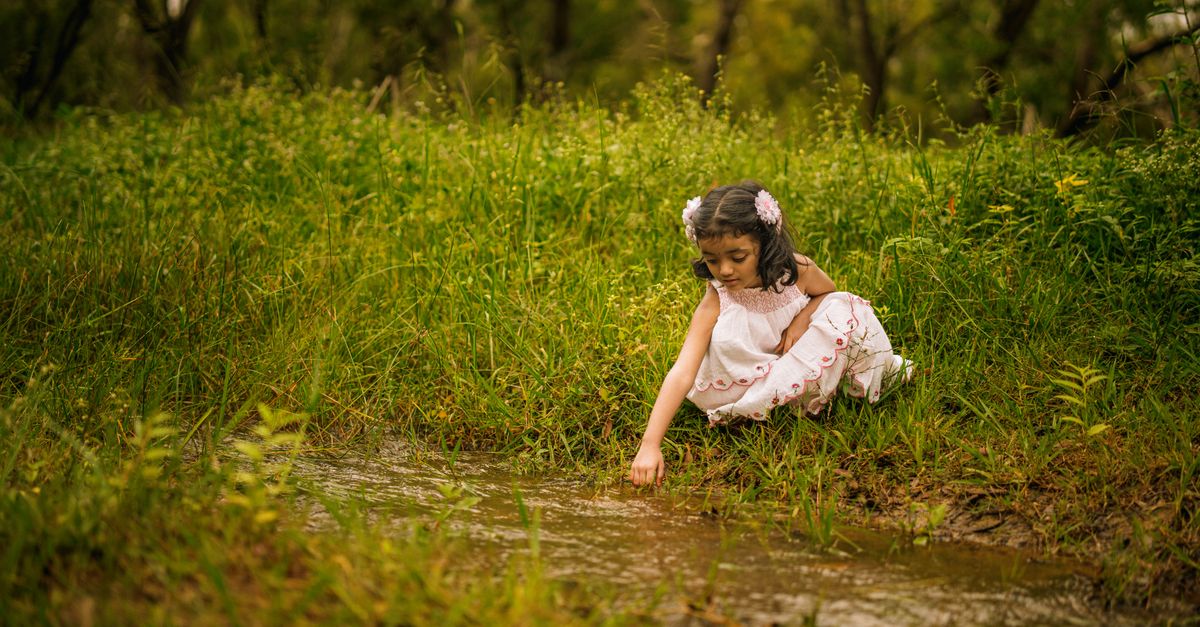 Little Exploring Little Girl Exploring Nature by a Stream in Tumakuru · Free Stock Photo