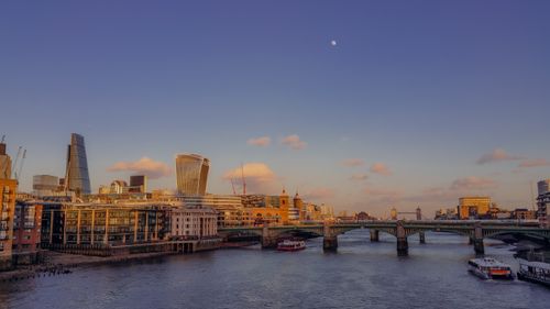 Free Beautiful view of London's skyline featuring modern architecture and the Thames at twilight. Stock Photo