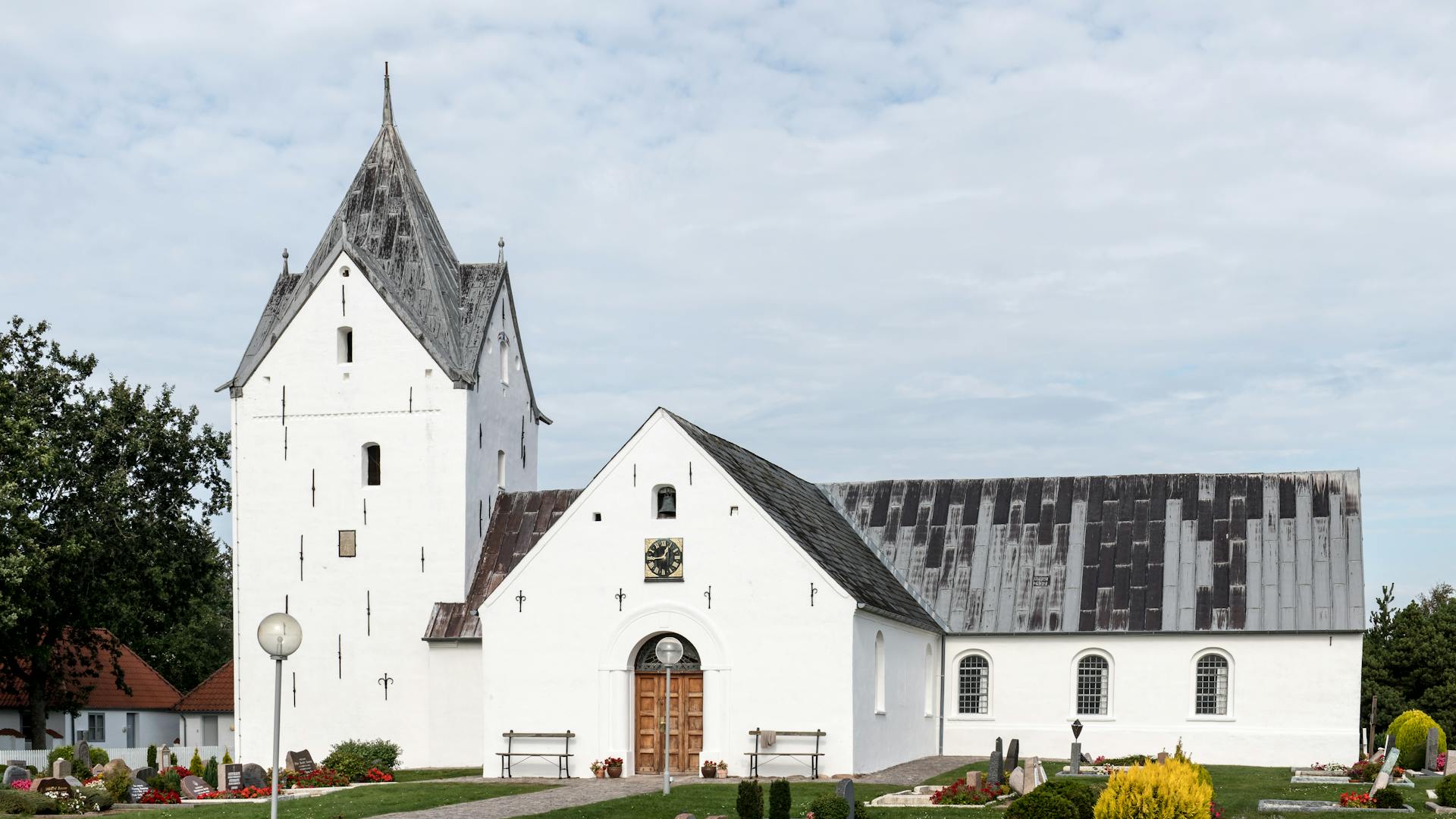 Historic Danish Church with Clock Tower in Countryside