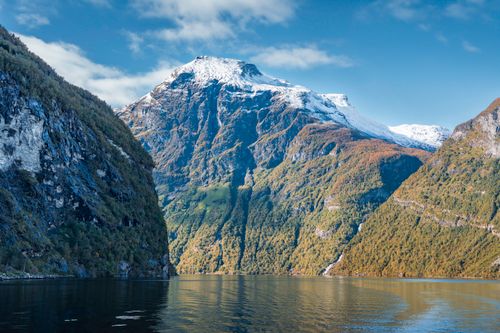 Free Breathtaking view of a snow-capped mountain and fjord in Norway, perfect for nature lovers. Stock Photo