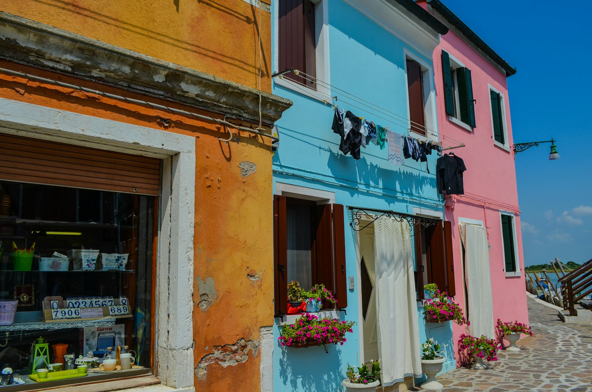 Colorful Houses in Burano, Venice Under Blue Sky