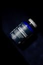 Close-Up of Collagen Supplement Bottle on Dark Surface