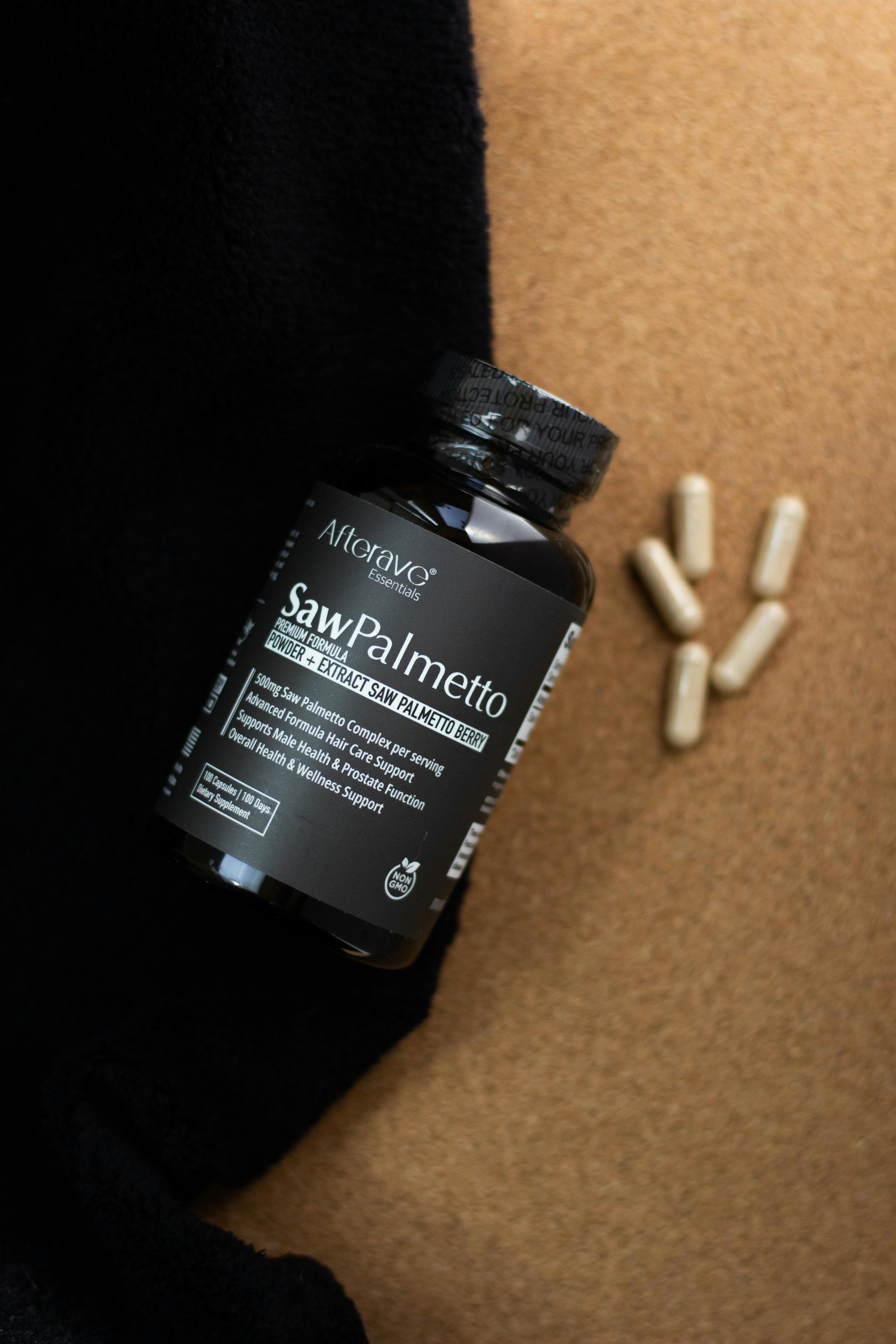 Saw Palmetto supplement bottle placed with capsules on a textured surface for health and wellness support.