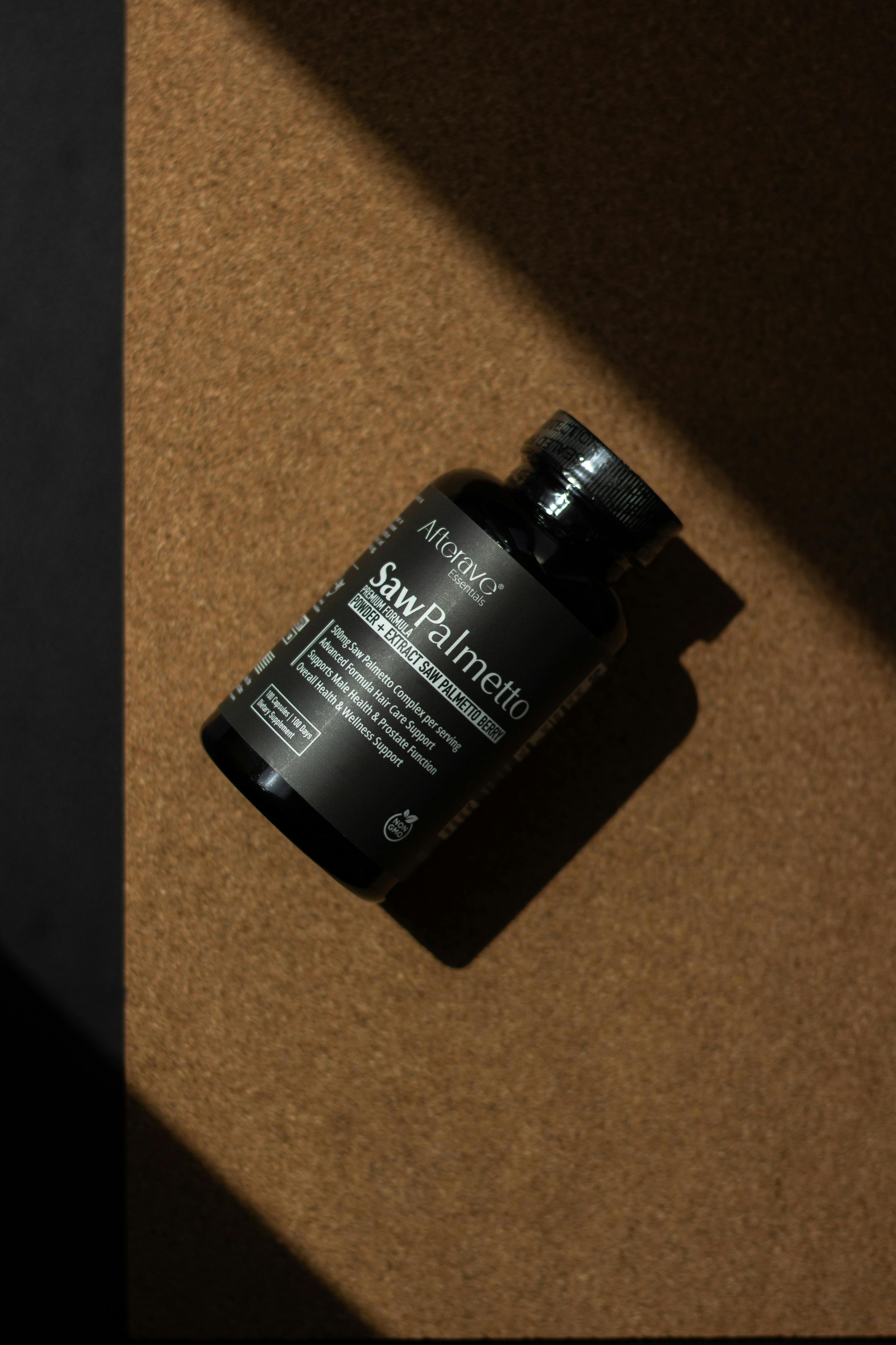 Saw Palmetto supplement bottle captured in warm shadow lighting.