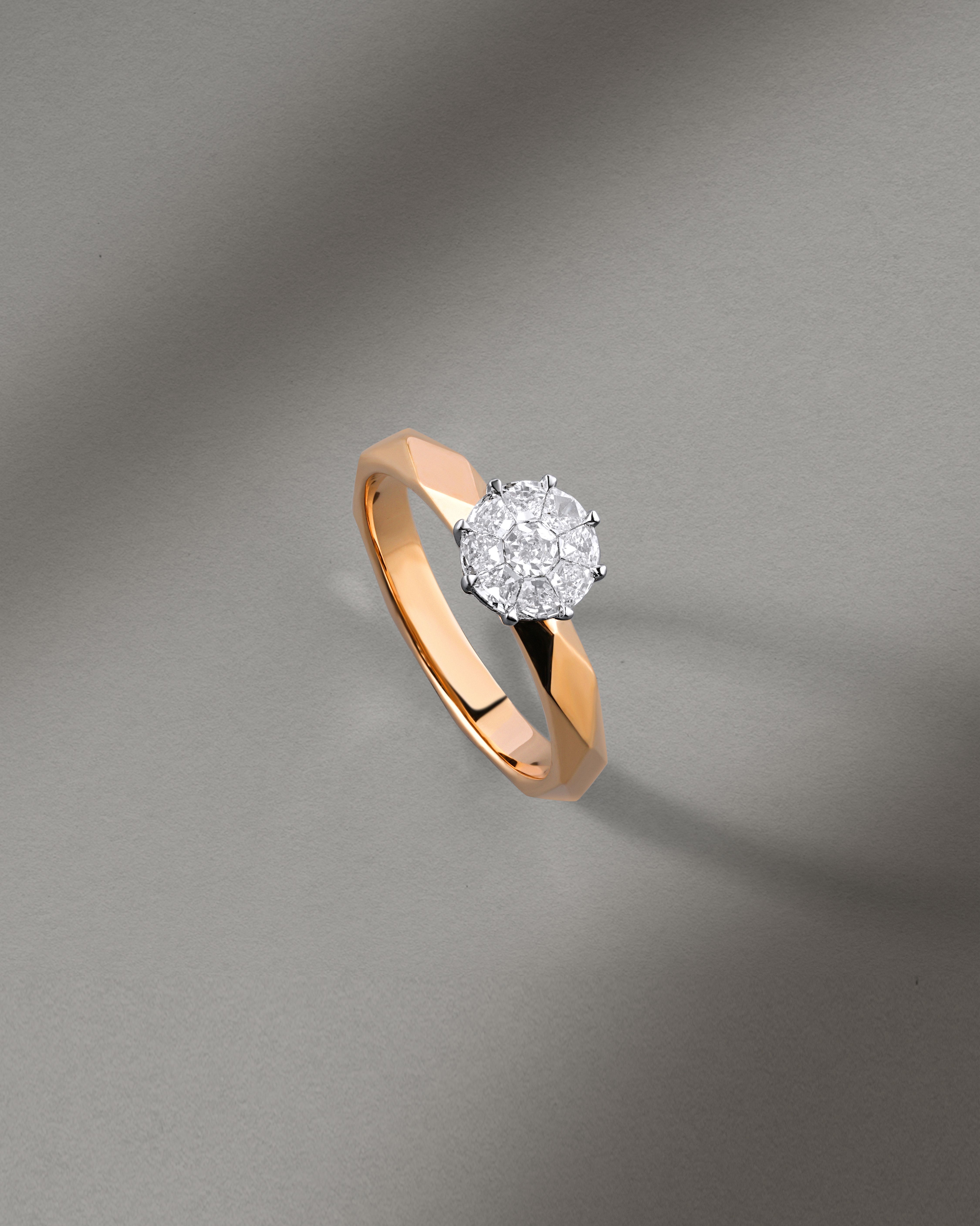 A beautifully crafted diamond ring with a rose gold band, perfect for elegant and sophisticated occasions.