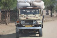 Vintage Truck Loaded with Cargo on Rural Road