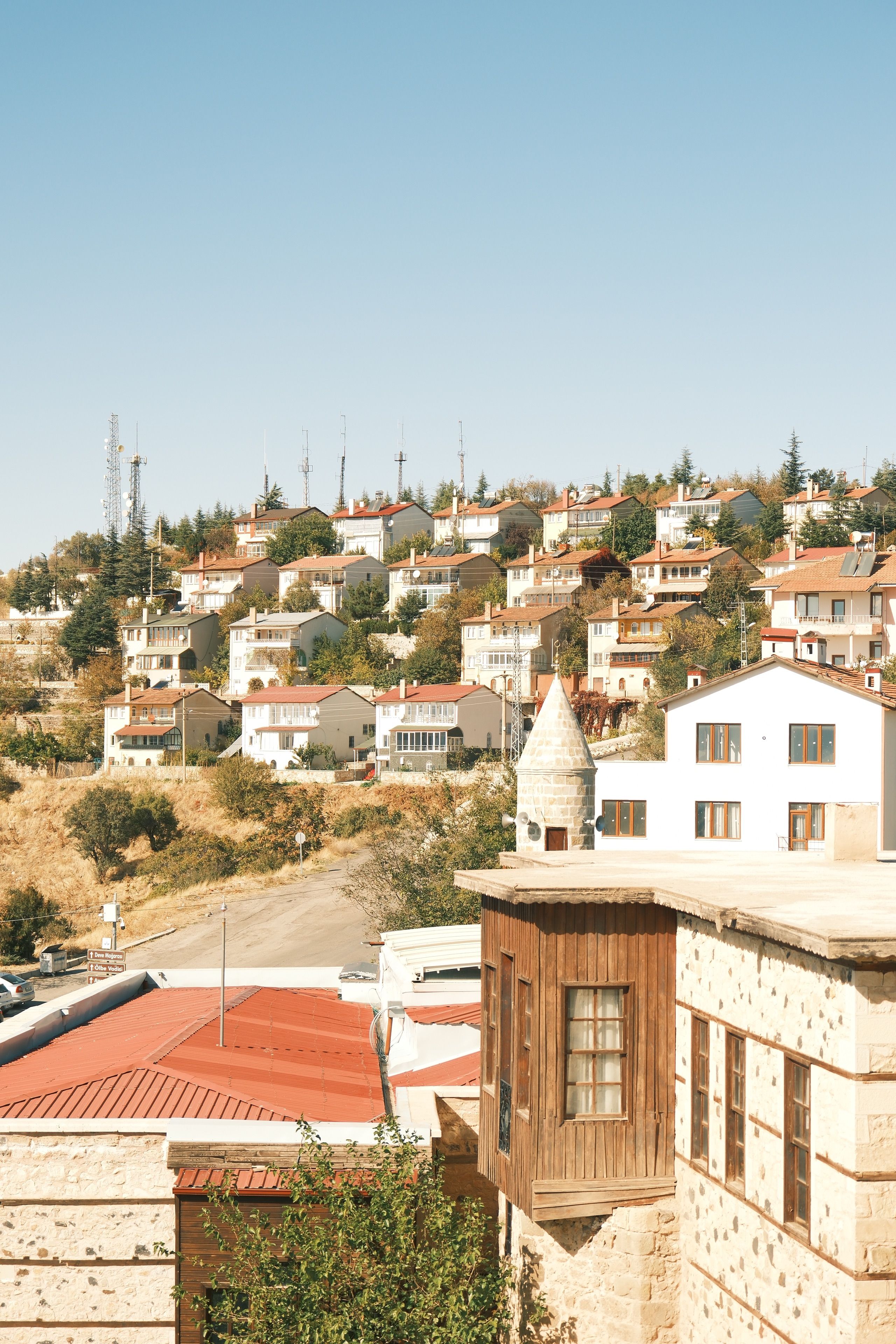 Charming Hillside Village with Rustic Houses · Free Stock Photo