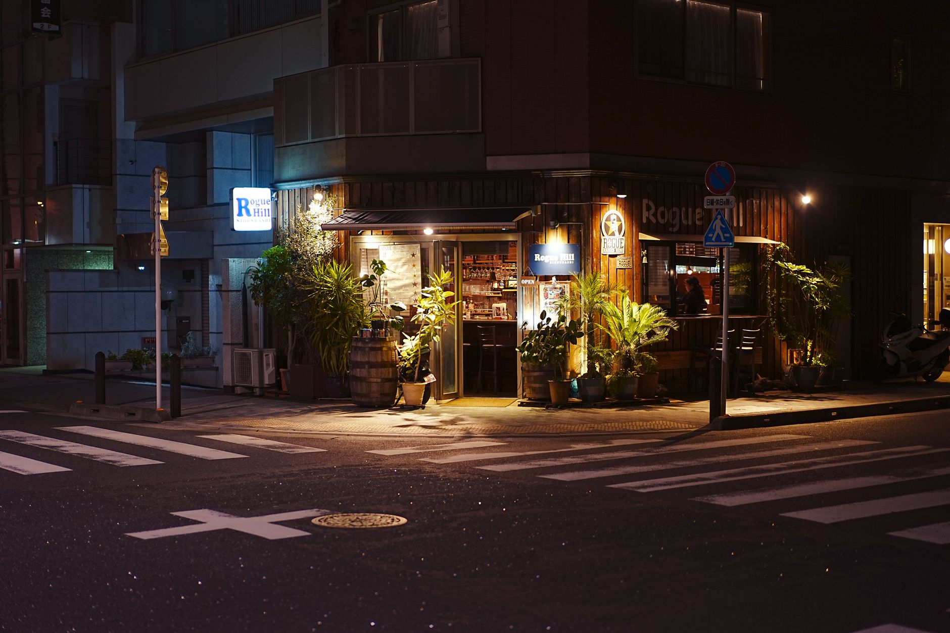 Entryway of a Tokyo maid caf, showing warm lights and cute decorations